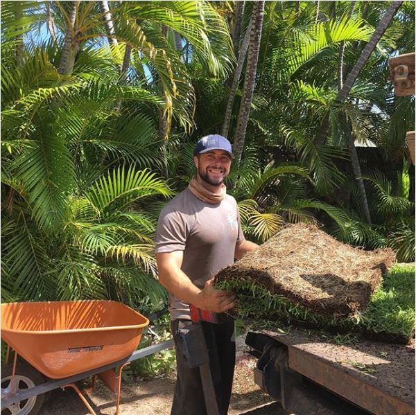 Image of employee installing sod